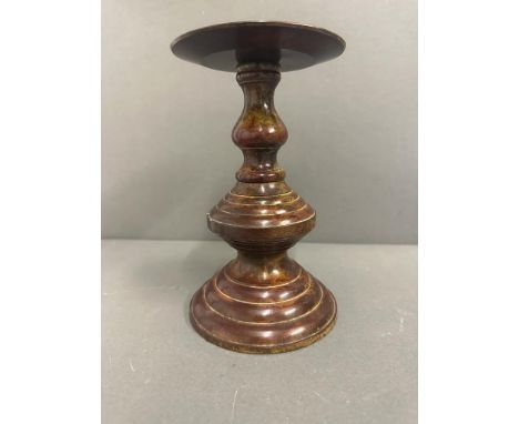 A bronze candlestick 19.5cm H