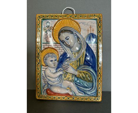 A ceramic painted wall hanging plaque depicting Mary and child 20cm x 27cm 