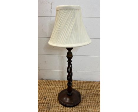 A walnut table lamp with spiral twist column