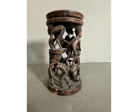 A carved African candle stick 