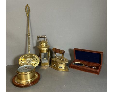 A small selection of quality brass to include an iron, a boxed magnifying glass and a barometer 