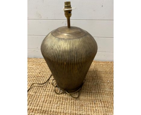 A brass metal effect ribbed table lamp (H50cm)