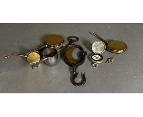 A selection of brass and white metal curios to include bottles and a compass