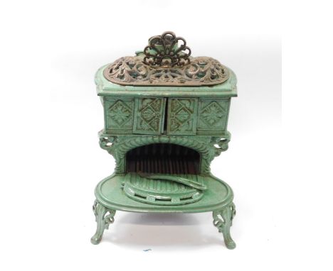 A Victorian cast iron and green enamel 'Carron' stove, possibly by Smith &amp; Wellstood., double ring with sliding blower do