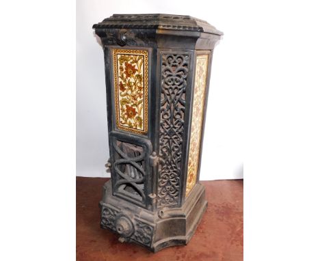 A French late 19thC cast iron and enamel Goudin stove, by Dequenne &amp; Cie., of canted square form with pierced foliate pan