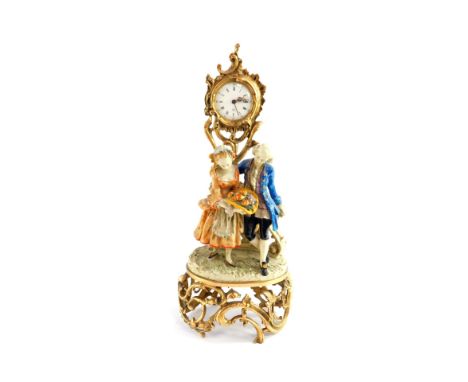A French 20thC figural mantel clock, enamel circular dial bearing Roman and Arabic numerals, centre seconds, eight day moveme