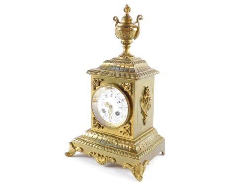 A late 19thC French brass cased mantel clock, circular enamel dial bearing Roman and Arabic numerals, eight day movement with