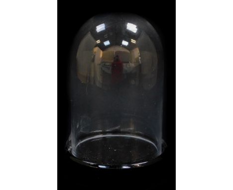 A cut glass dome, on a ceramic base, 26cm high.