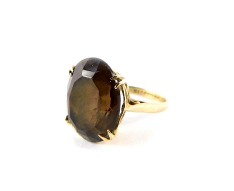 A 9ct gold and smokey quartz ring, oval cut, size K, 4.5g.