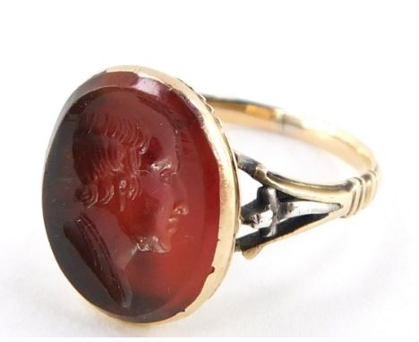 A Victorian Cornelian ring, intaglio carved with the bust portrait of a gentleman, set in yellow metal, size L, 2.7g.