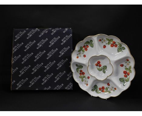 A Royal Worcester porcelain hors d'ouevres dish decorated in the Strawberries pattern, of six division fluted form, printed m