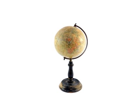 A Geographia 6" terrestrial globe, published by Geographia Ltd, 55 Fleet Street, London., raised on an ebonised wooden base.