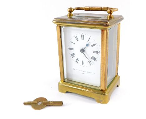 A French early 20thC brass cased carriage clock, The Jewellers &amp; Silversmiths Company, Paris., the case of conventional f