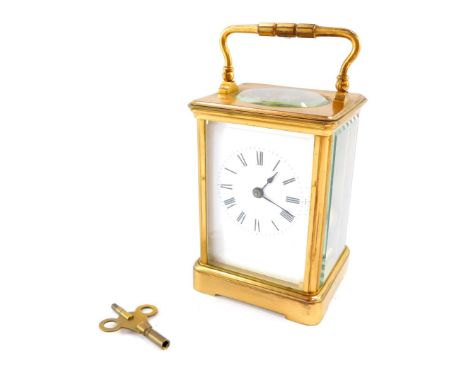 A French brass carriage clock, rectangular enamel dial bearing Roman numerals, twin barrel movement, with coil strike, the ca