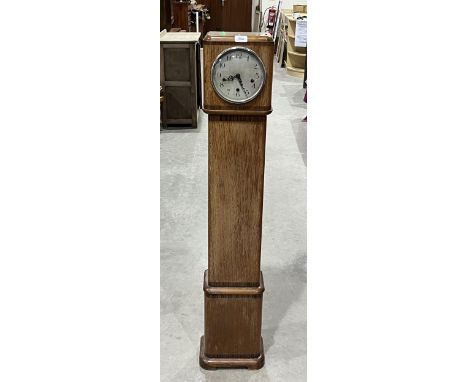 An Art Deco oak 'grandmother' clock, the Enfield Clock Company three train movement Westminster chiming and striking on eight