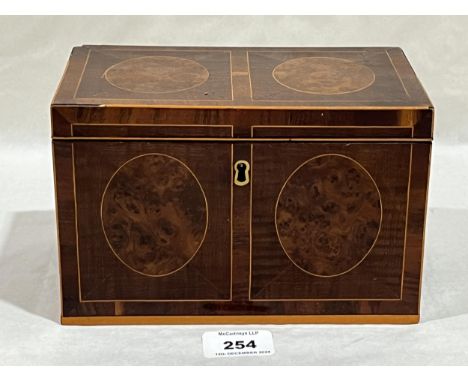 A 19th Century satin and burr wood tea caddy, 8" wide.