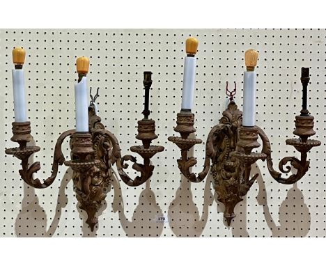 A pair of giltwood and gesso three light wall sconces.