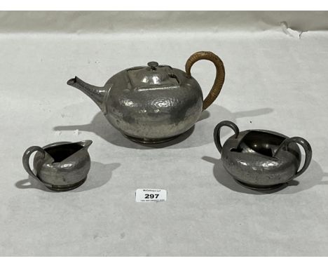 An Arts and Crafts 'Tudric' pewter three piece service.