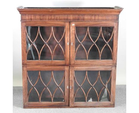 A George III mahogany and ebony strung dresser top, enclosed by lattice glazed doors. Note: a non-transferable ivory exemptio