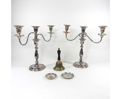 A pair of plated twin branch candelabra, 37cm high, together with a brass table bell and two Chinese silver dishes, each inse