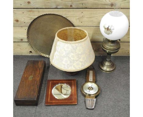An early 20th century brass oil lamp, together with a copper lamp, tray, inlaid mirror, cutlery box and barometer