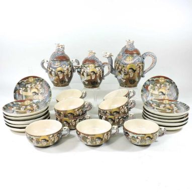 An early 20th century Japanese Satsuma part tea set, decorated with figures, signedOverall crazing to the body and a brown di