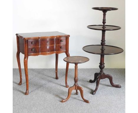 An early 20th century mahogany three tier dumb waiter, 105cm high, together with a reproduction side table and a tripod table