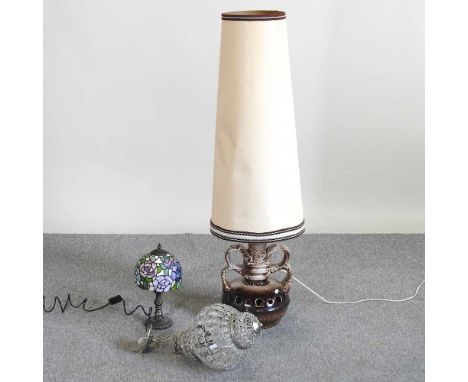 A 1960's West German stoneware table lamp and shade, 118cm high overall, together with a Tiffany style table lamp and a glass
