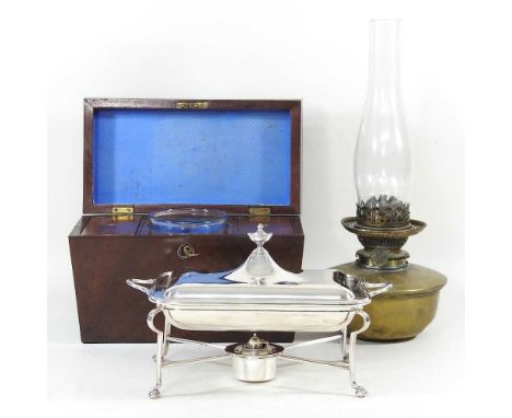 A 19th century silver plated entree dish, together with a brass oil lamp and a late Regency mahogany tea caddy, 30cm wide (3)