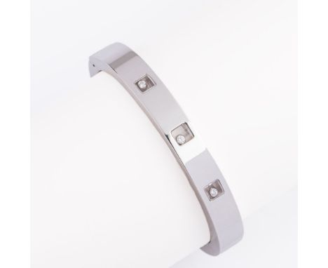Chopard. Armreif 'Happy Diamonds'. 18kt. WG, gest., MZ: Chopard, num. 2470860 85/3035, Größe M. Gekanteter Reif, schauseitig 