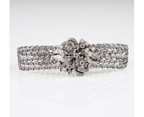 Vintage Gold-Armband mit Brillant-Besatz. Um 1960. 18 kt. WG, gest., ziseliert und poliert. Breites Armband im mehrreihigen F