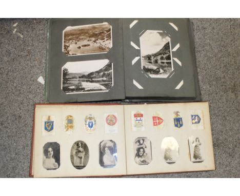 A VINTAGE POSTCARD ALBUM, TOGETHER WITH AN OGDENS PHOTO ALBUM 