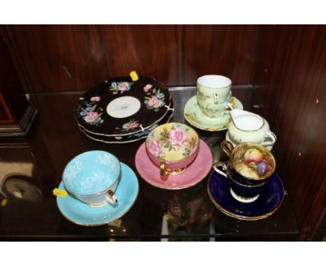 A COLLECTION OF AYNSLEY CUPS AND SAUCERS ETC. TO INCLUDE TWO CUPS AND SAUCERS WITH FLORAL INTERIORS, TWO COBALT BLUE COFFEE C