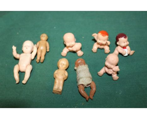 A BAG OF VINTAGE MINIATURE TOY DOLLS  