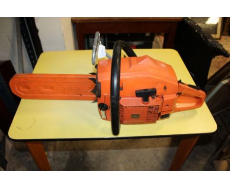 A HUSQVARNA PETROL CHAINSAW