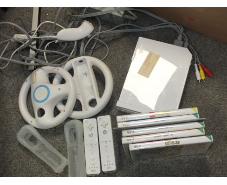 A NINTENDO WII CONSOLE WITH ACCESSORIES AND GAMES