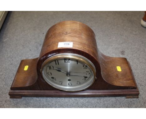 A MAHOGANY NAPOLEON HAT MANTEL CLOCK WITH INLAID CROWS FOOT STYLE DETAILING TO TOP 