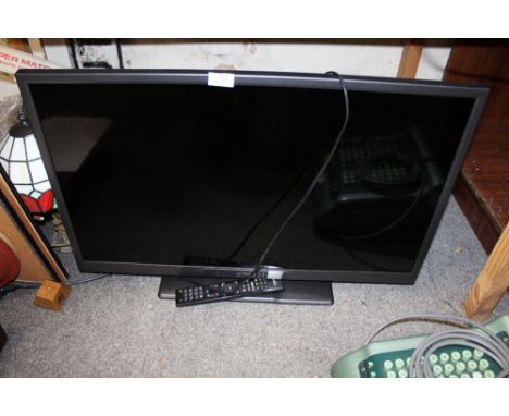 A HITACHI 32" FLATSCREEN TV WITH REMOTE