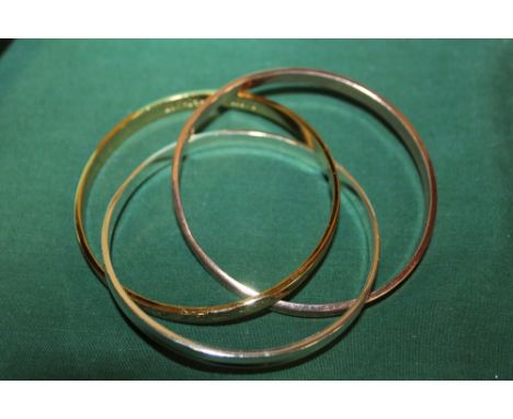 A REPRODUCTION TIFFANY STYLETRIPLE BANGLE WITH BOX AND BAG