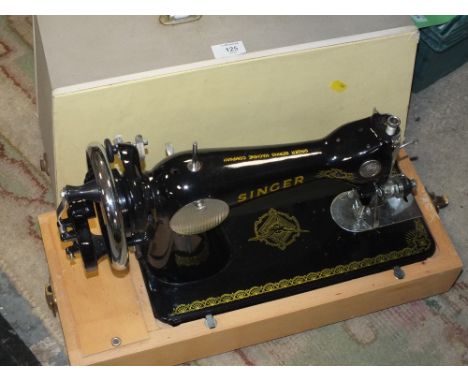 A CASED VINTAGE SINGER SEWING MACHINE
