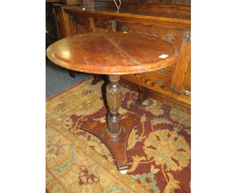 A NINETEENTH CENTURY CARVED PEDESTAL TABLE, on ceramic bun feet, Dia.. 61 cm, H 72 cm