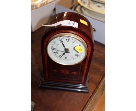 A REPRODUCTION MANTEL CLOCK