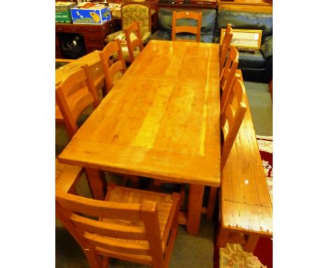 An oak farmhouse table with two drawers and two extension leaves by Antix with 8 chairs and a refectory bench 220cm (86.5in) 