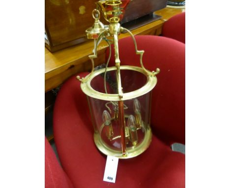 A Chalford four light brass and glass ceiling lantern.