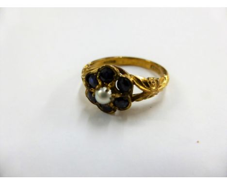A 9ct gold, sapphire &amp; seed pearl cluster ring