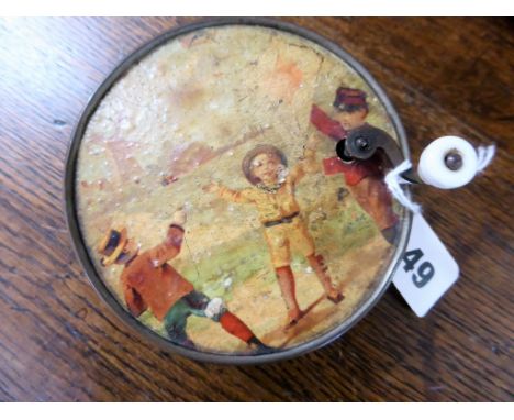 An antique French manivelle music box the brass case with embossed lyre decoration, the top with children playing, the serpen
