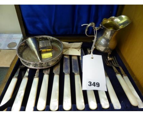 A cased set of EPNS mother of pearl dessert knives &amp; forks together with a early cream jug; candle snuffer; wine coaster 
