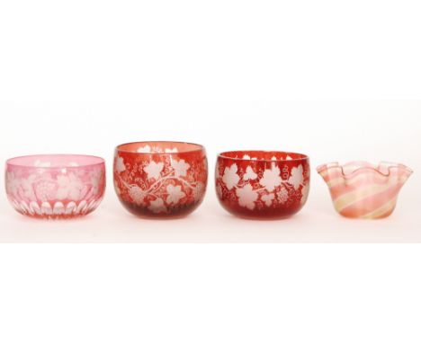 A composed pair of late 19th Century Bohemian glass finger bowls flashed in ruby over clear and engraved with fruiting vine d