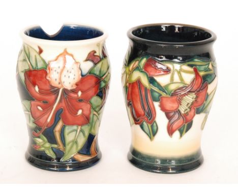 Two Moorcroft Pottery vases, the first decorated in the Kapok Tree pattern designed by Nicola Slaney, the second in the Simeo