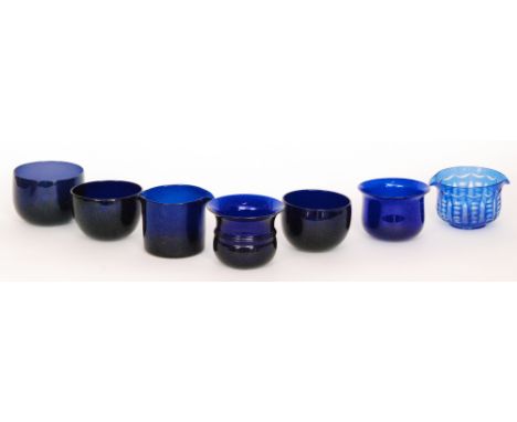 A 19th Century Bristol blue glass finger bowl of flared form with a central applied annulated ring, together three other simi